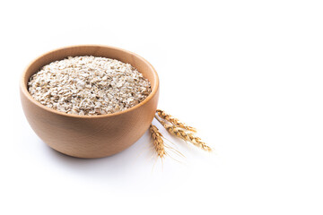 Rolled oats, healthy breakfast cereal oat flakes in bowl isolated on white background. Copy space