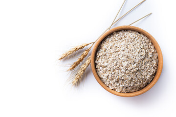 Rolled oats, healthy breakfast cereal oat flakes in bowl isolated on white background. Top view. Copy space