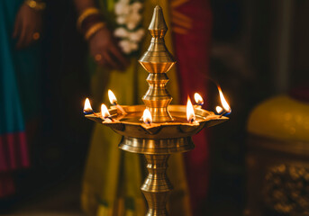 Traditional South Indian Nilavilakku Brass Oil Lamp Lit for Sacred Wedding Rituals and Celebrations