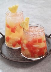 Es buah or sop buah-is an Indonesian iced fruit cocktail dessert. This cold and sweet beverage is made of diced fruits mixed with shaved ice or ice cubes, and sweetened with liquid sugar or syrup