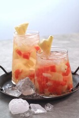 Es buah or sop buah-is an Indonesian iced fruit cocktail dessert. This cold and sweet beverage is made of diced fruits mixed with shaved ice or ice cubes, and sweetened with liquid sugar or syrup