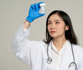 Asian gynecologist with cervical cancer specimen collection kit