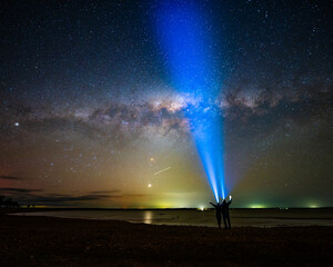 Star gazing: Milky Way over a lake, Waranga Basin, Waranga Shores, Victoria, Australia, with bright Venus in the sky.