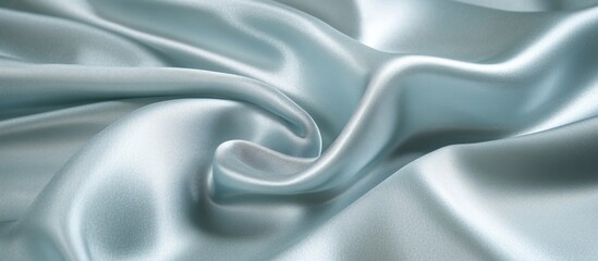 Obraz premium Gray blue shiny silk fabric texture with elegant folds and smooth surface close up for design and background use