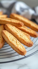Freshly baked biscotti arranged on a cooling rack with a soft background highlighting their golden color and texture