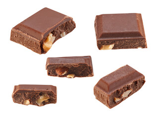 Several slices of dark chocolate with nuts, close-up, isolated on white.