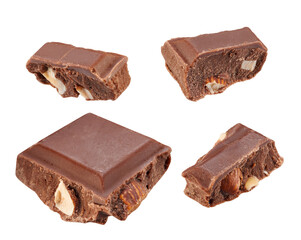 Several slices of dark chocolate with nuts, close-up, isolated on white.