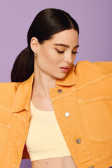 Stylish young woman showcasing vibrant fashion against a colorful backdrop