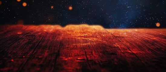 Red wooden surface texture under starry night sky with mystical glowing elements creating an enchanting atmosphere.
