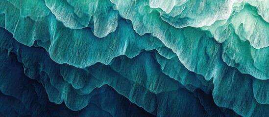 Obraz premium Textures and patterns on water surface showcasing vibrant shades of blue and green creating a striking abstract background.