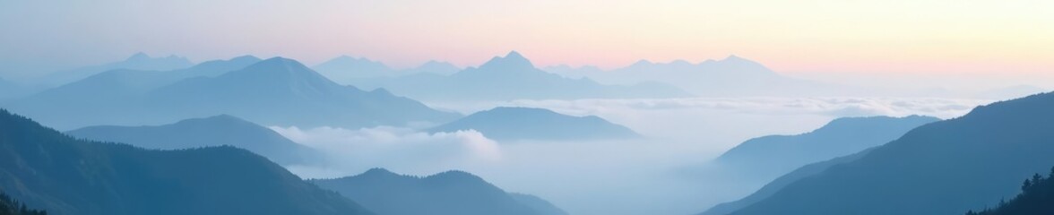 Obraz premium Mountain peaks shrouded in a thick layer of fog, mist, clouds