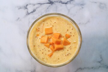 Mango Sago Dessert is Made from Puree Mango, Sago Pearl, and Coconut Milk top with Sliced Mango