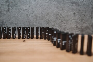 Domino effect in motion on wooden surface