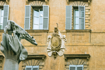 Fototapeta premium Facade of old buildings in the historical center of Siena, the UNESCO World Heritage Centre, unchanged for 13-14 centuries, with its medieval streets looked like in the early Middle Ages. Italy, 2019