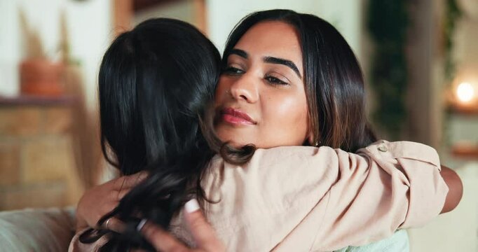 Women, friends and hug with support for care, love or trust from grief, loss or breakup in living room. People, empathy and embrace for emotional trauma, sad news or tough time comfort in home lounge