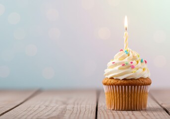 A Festive Birthday Cupcake with Frosting and Candle