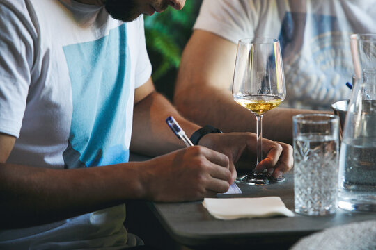 Sommelier school. Professional wine waiters are trained, close up. Winemaking courses, wine tasting. 