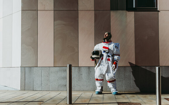 spaceman in a futuristic station - Powered by Adobe
