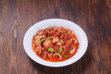Sambal Cumi Pete is Indonesian Food made from squid with chili and petai. Smells so good. Spicy Food.
