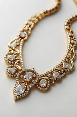 Sparkling Crystal Necklace: An intricate and elegant gold necklace adorned with dazzling clear crystals, featuring a unique teardrop design that adds a touch of timeless sophistication. 