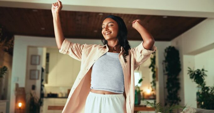 Smile, woman and fun for dancing at house with energy, freedom and movement for music rhythm. Happy, female person and celebration with good news, weekend break and performance routine in living room