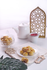 Kue nastar or pineapple tart. indonesian eid snack. on a white plate. bright mood style. perfect for recipe, article, catalogue, or any commercial purposes.
