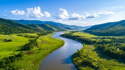 Obraz premium reforestation seedlings, evergreen. A serene landscape featuring a winding river, lush green hills, and a clear blue sky, showcasing the beauty of nature.