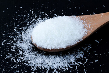 Monosodium Glutamate Crystals in Wooden Spoon