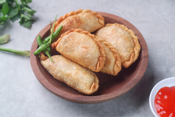 Pastel goreng or chicken and vegetables fried puff is one of the very famous Indonesian snacks

