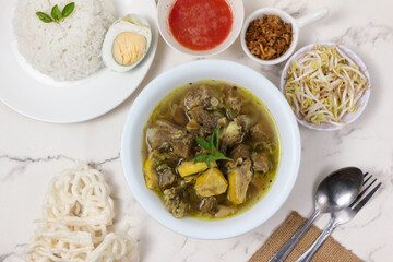 Indonesian Goat Soup with Rice and Condiments