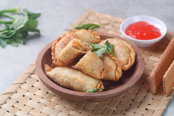 Pastel goreng or chicken and vegetables fried puff is one of the very famous Indonesian snacks
