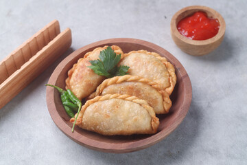 Pastel goreng or chicken and vegetables fried puff is one of the very famous Indonesian snacks
