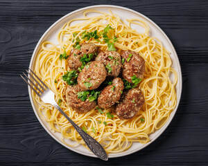pork burger steak with spaghetti on a plate