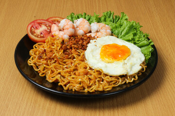 Delicious Indonesian Mie Goreng with Fried Egg, Shrimp, and Tomato