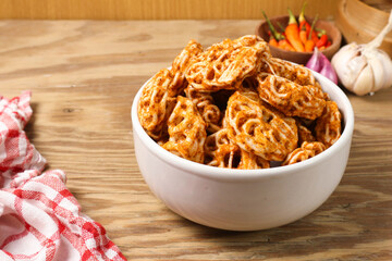 Spicy Kerupuk Snacks in a Bowl on Wooden Table