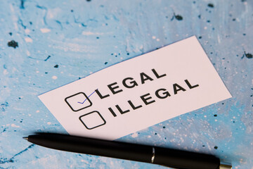 Legal and illegal checkbox concept on a blue background