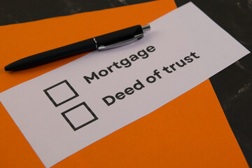 Mortgage and deed of trust checklist on table
