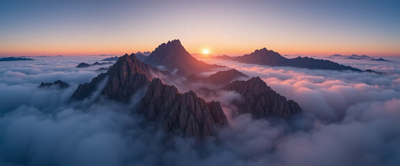 Sunrise over foggy mountain peaks