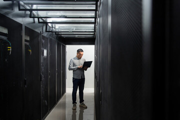 Fototapeta premium asian male engineer working in database