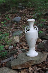 antique vase in the woods