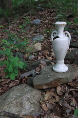 antique vase in the woods