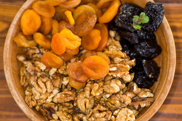 Natural dried Prunes, dried apricots and nuts close-up in macro photography