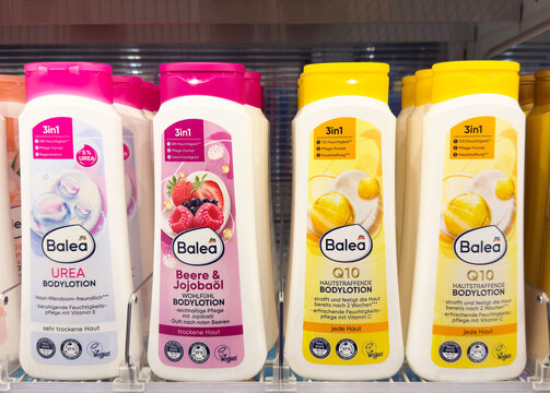 Assorted balea bodylotions on store shelf with various scents and benefits