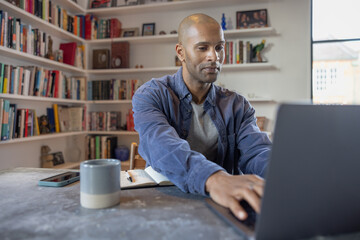 Man engaged in productive work at his desk