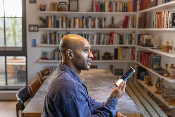 Man on Phone using artificial intelligence in Home Office Setting