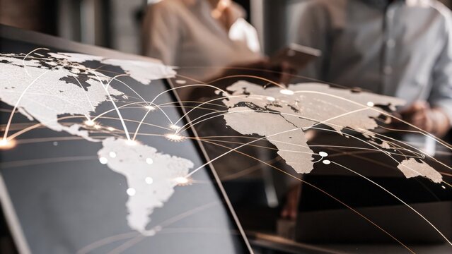 A close view of a holographic representation of a global supply chain network with animated logistics pathways and changing data metrics demonstrating complex business operations.