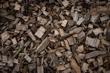 Close-up of small wooden blocks with natural texture and grain, perfect for a rustic or nature-themed background.
