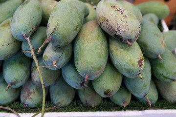 There are many kinds of fruit in Thailand. The one that Thai people like to eat is called unripe mango.