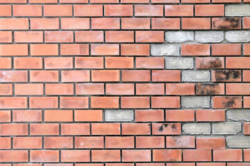 damaged red brick wall texture background, repairing old brick wall with some pieces missing