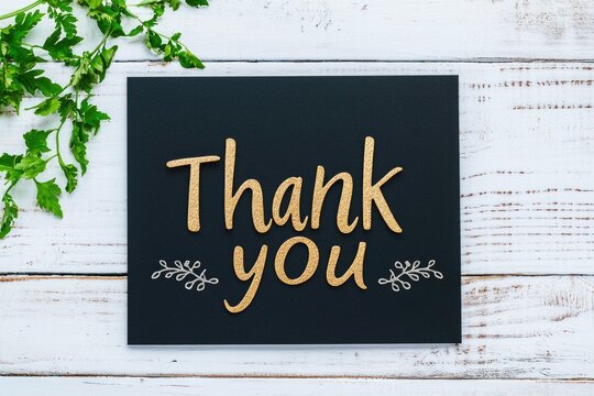 Elegant handwritten thank you message on black card
